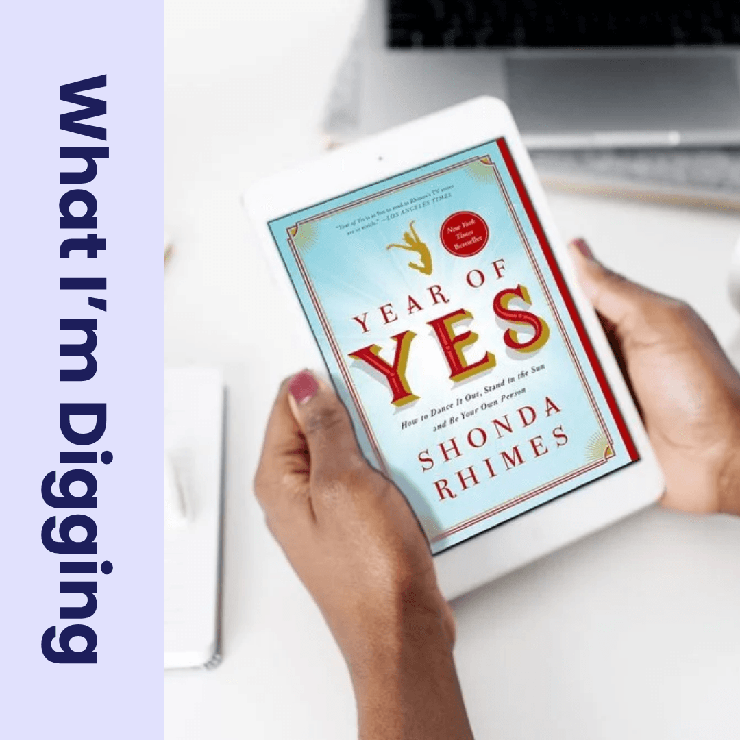 brown hands holding kindle with Year of Yes cover